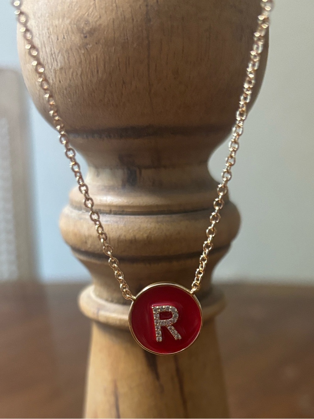Gold-Tone Necklace with Red Initial 'R' Pendant with cubic zirconia.